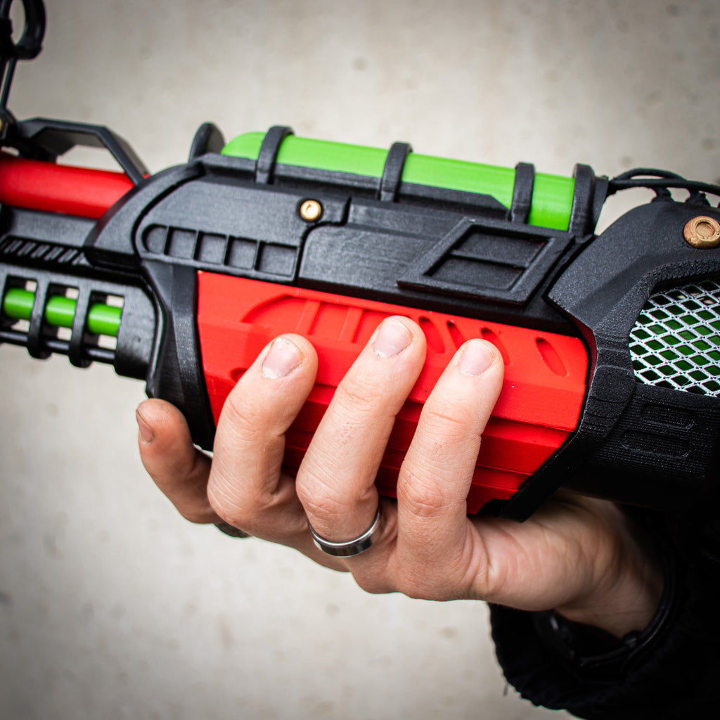 Close-up of the red body panels and green tube on the finished Ray Gun Mk II-inspired prop