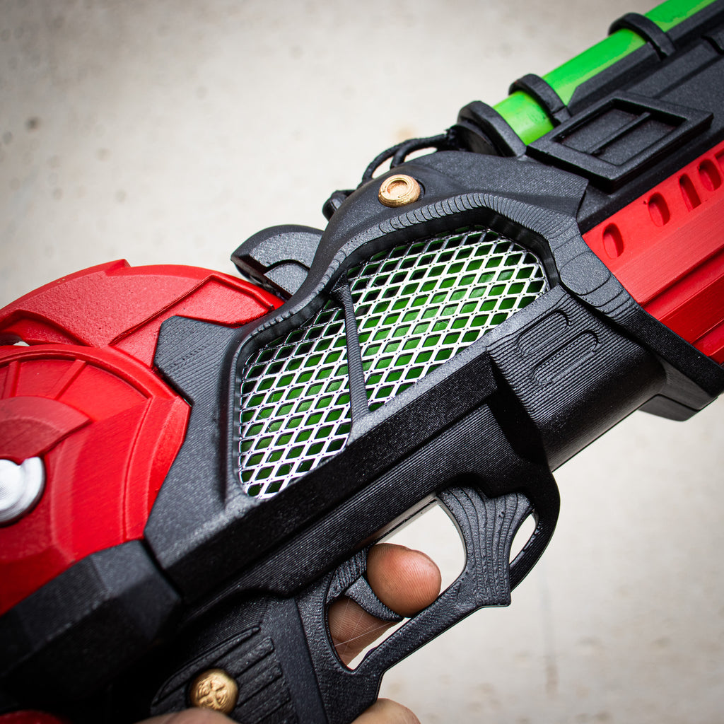 Close-up of the grip, mesh and layered surface details on the finished cosplay prop