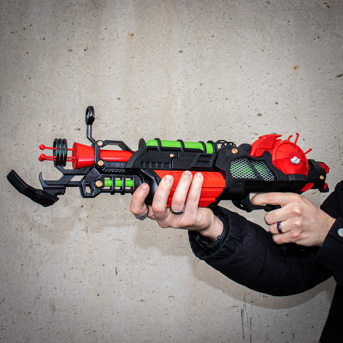 Side profile of the finished Ray Gun Mk II-inspired 3D printed cosplay prop held in both hands