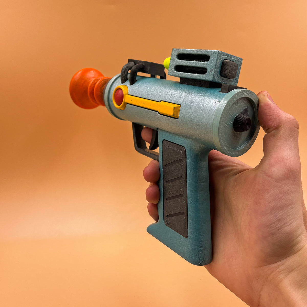 Close-up of the laser gun prop's top controls and coloured details
